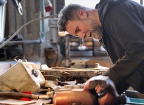 Middle-aged man working in a workshop