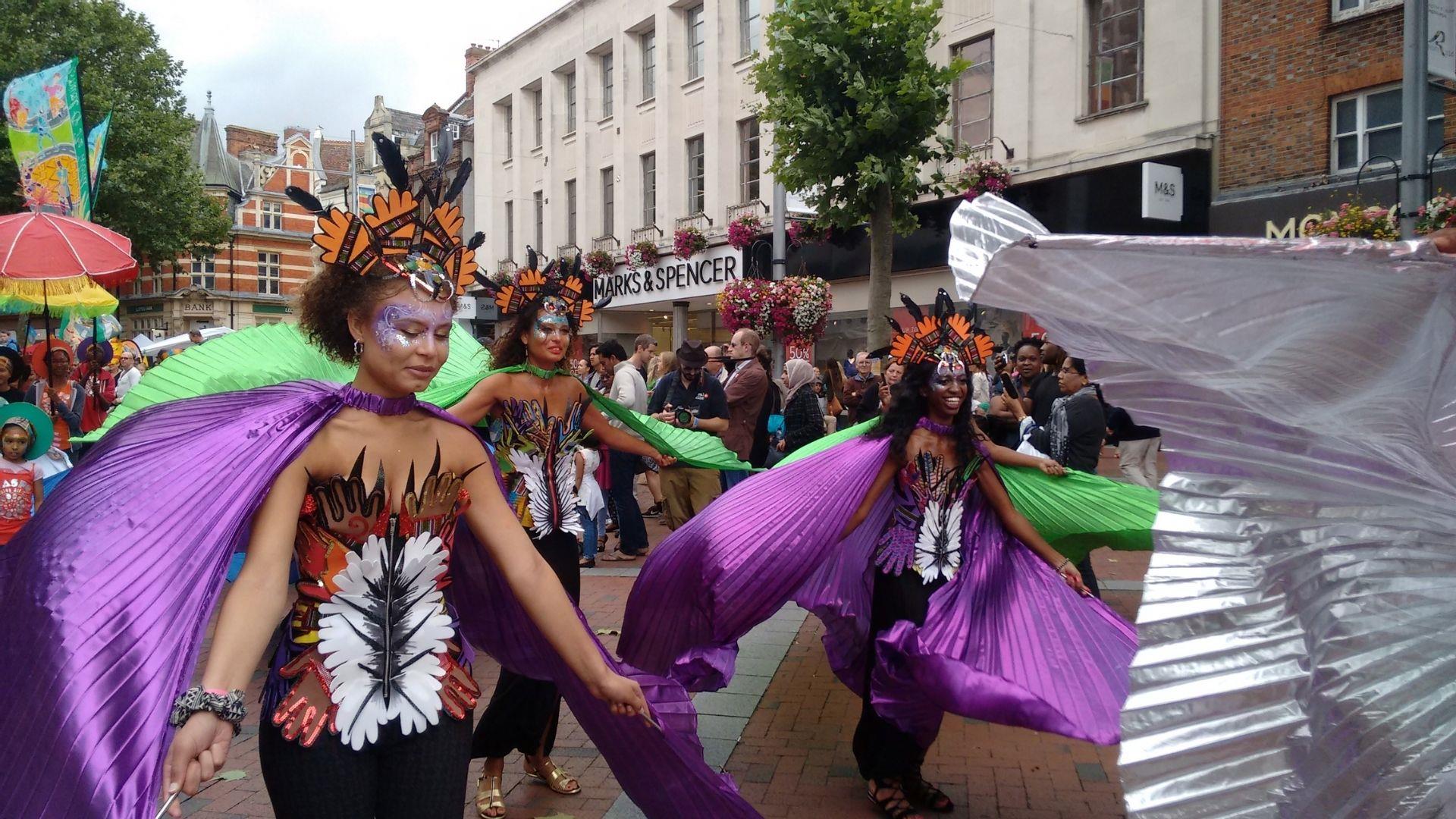 Carnival of the World festival in Reading showing female dancers on the high street.