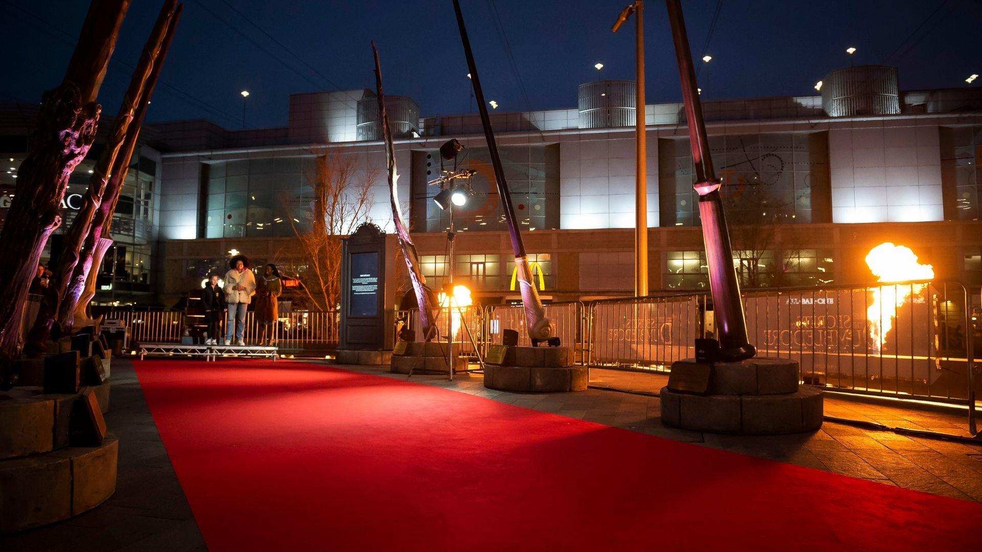 Red carpet with nine Harry Potter wands lit up at The Oracle Riverside, Reading