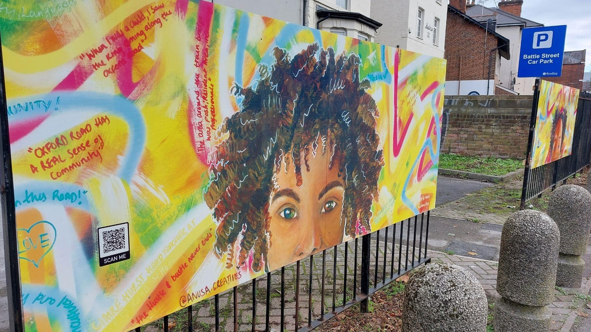 Mural artwork on Oxford Road, Reading, showing a black woman surrounded with quotes from the community.