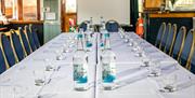 long table laid out with water