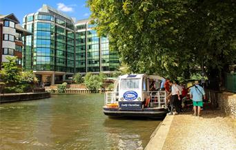 Boat on the River Kennet in front of office block