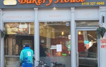 delivery cyclist outside Bakery House