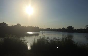 Dinton Pastures lake at sunset