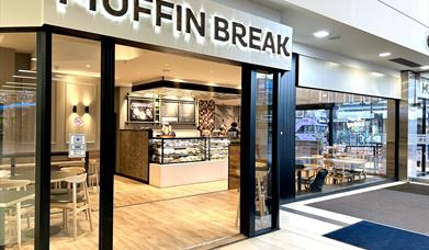 front of Muffin Break
