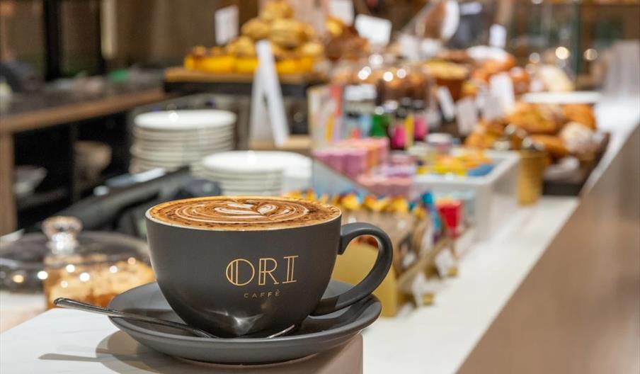 Mug with 'Ori Caffe' written on it in gold Mug with 'Ori Caffe' written on it in gold