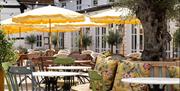 outdoor seating with yellow parasols