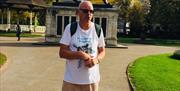 Terry stood in front of the Maiwand Lion in Forbury Gardens