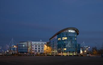 Night time exterior of Voco Reading lit up