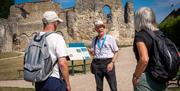 Graham Horn guiding 2 people in Reading Abbey Ruins