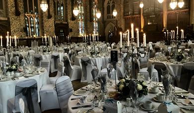 The Great Hall at Rochdale Town Hall, with dining tables set for a special event.