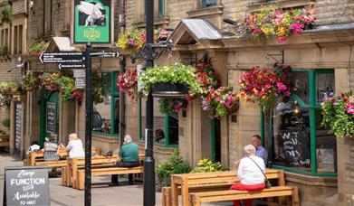 Customers dining outside the Flying Horse Hotel.