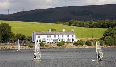 Hollingworth Lake Country Park with pub and windsurfers