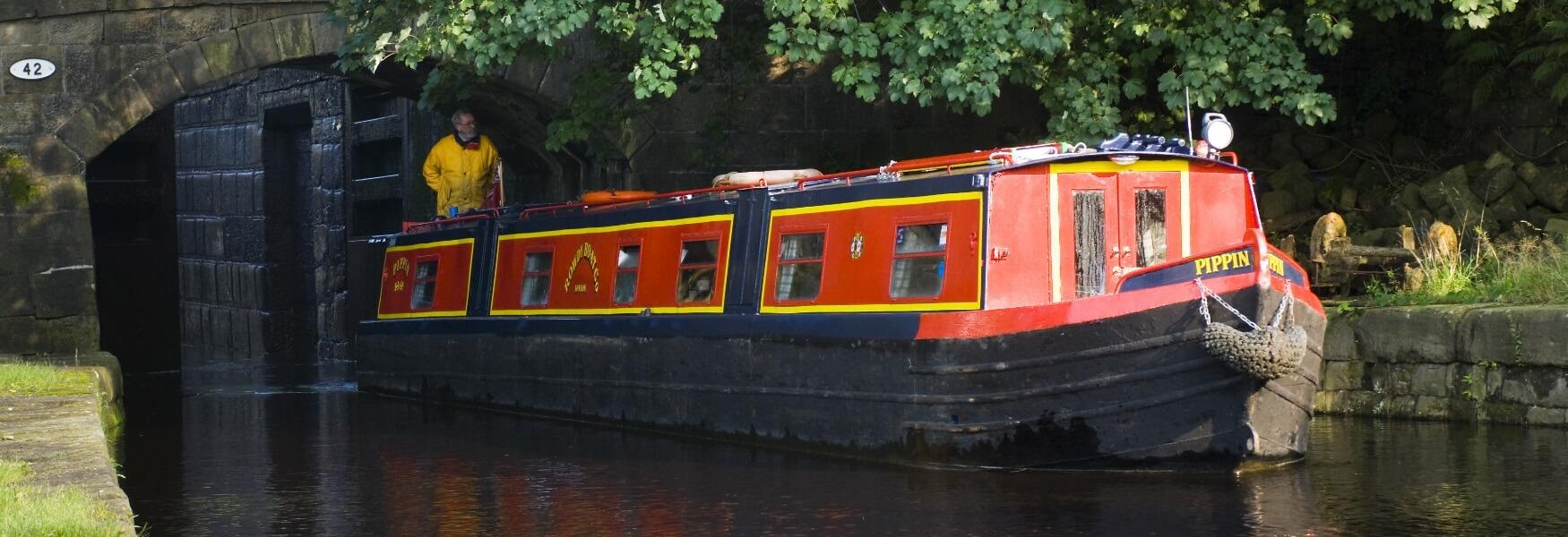 A barge sailing through the Summit Canal Lock.