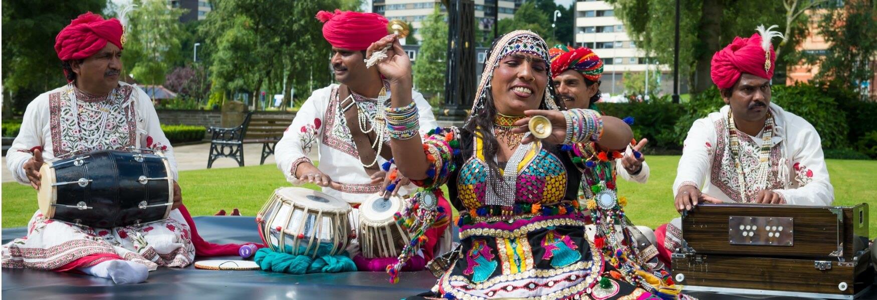 A group of Indian musicians with hand drums.