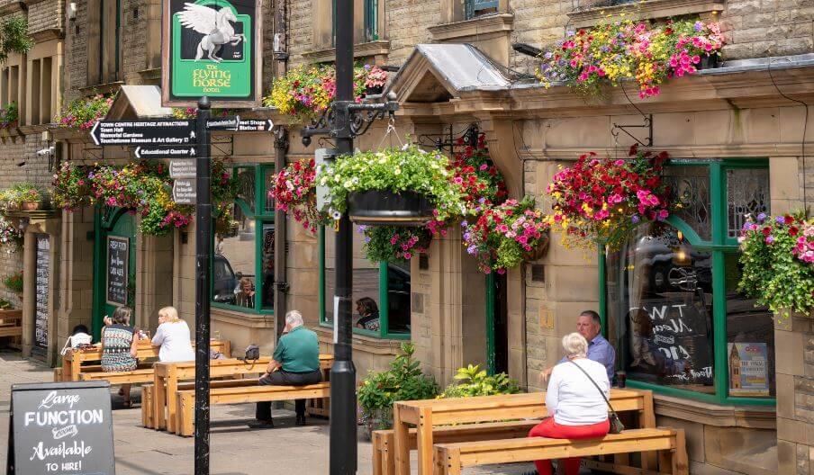 Customers dining outside the Flying Horse Hotel.