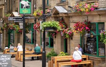 Customers dining outside the Flying Horse Hotel.