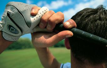 A golfer taking a swing.