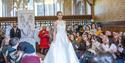 A bride walking down a fashion catwalk.