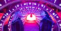 Image of people looking up at the light display