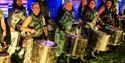 Image of a band holding drums