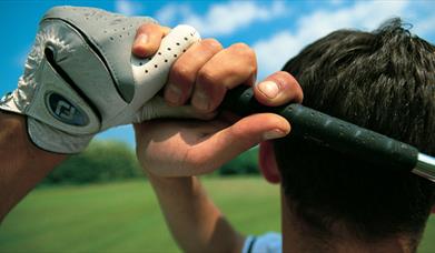 A golfer taking a swing.