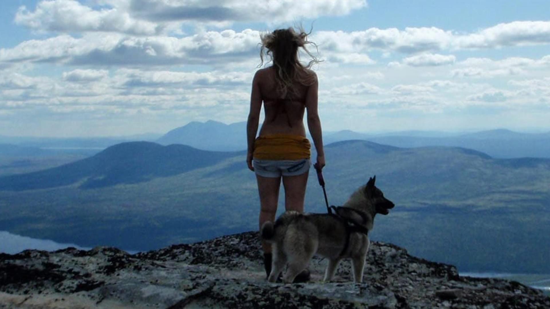 Girl watching mountain scenery