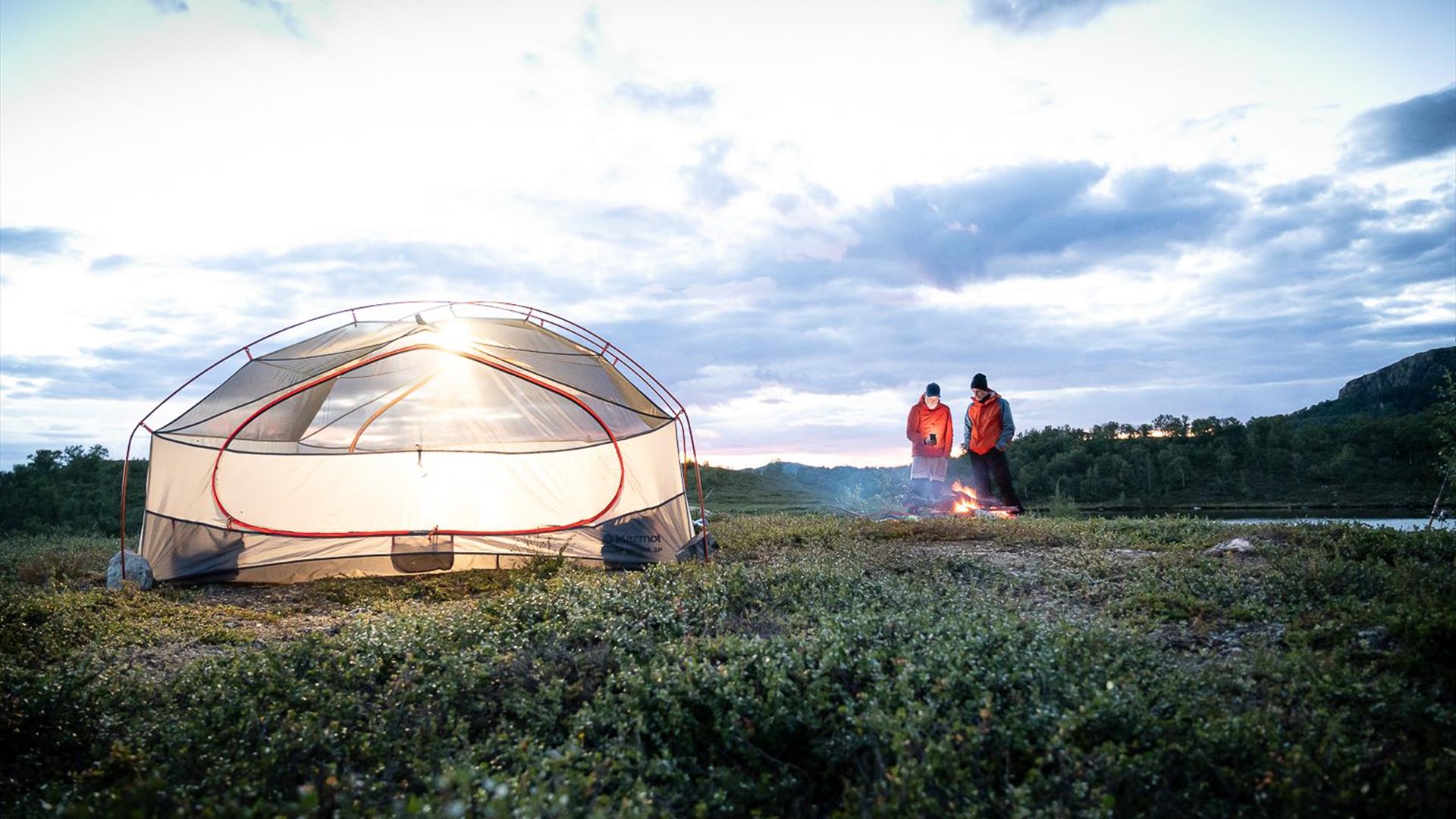 Summer and tent. Bonfire with friends.