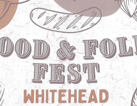 Notice with food illustrations stating Food & Folk Fest Whitehead