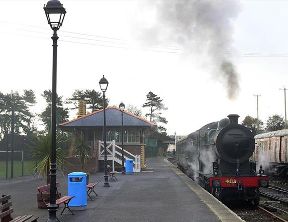Steam train onn platform at Whitehead Railway Museum