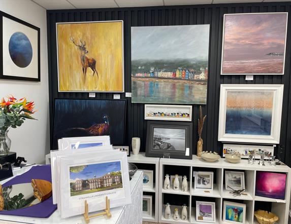 Display of various sizes of wall mounted art