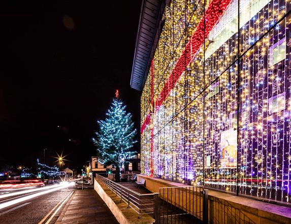 Christmas lights on tree and lights in window like a christmas box bow on Braid Centre