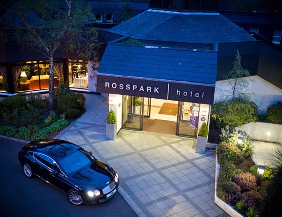 Night time exterior of entrance to Ross Park Hotel in Kells with car parked outside