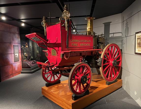 Red vintage pull along fire carriage branded Carrickfergus Fire Brigade