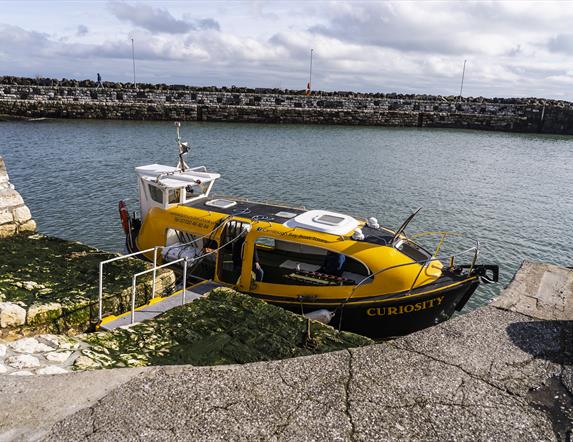 Curiosity boat sitting in Carlough harbour.