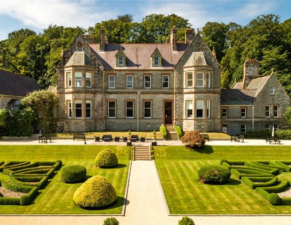 Magherarmorne Estate gardens with house to the rear