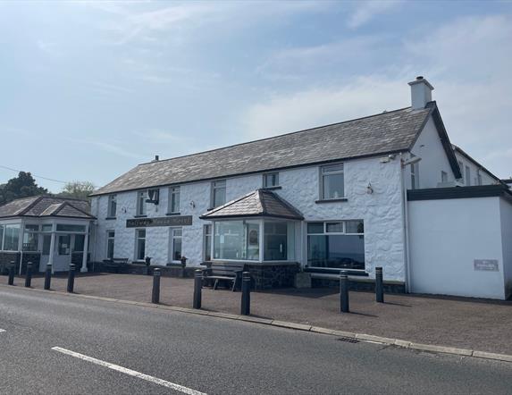 Whitewashed wall exterior of Halfway House Hotel in Ballygally