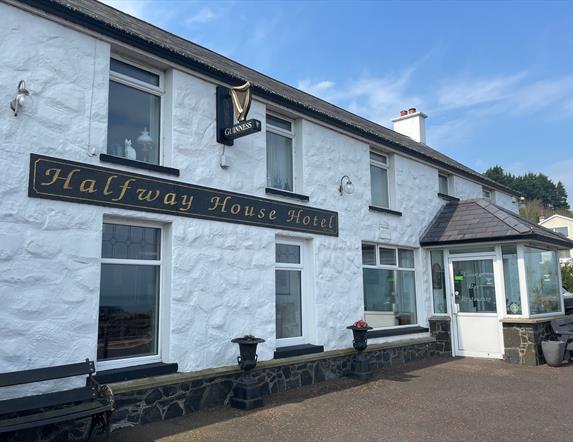 Whitewashed wall exterior of Halfway House Hotel in Ballygally