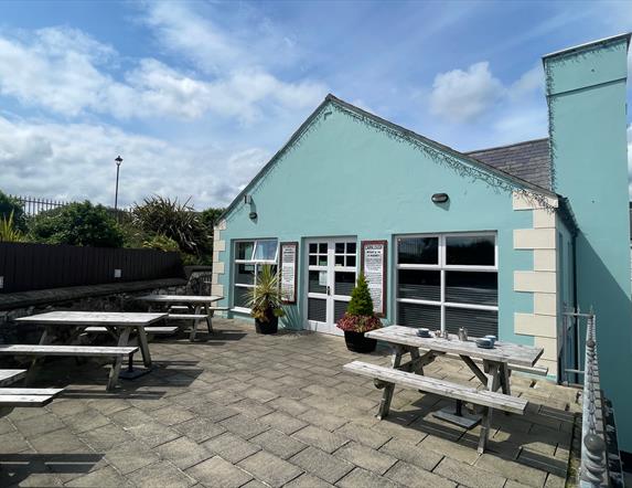 Exterior seating area of Harbour Lights Cafe in Carnlough