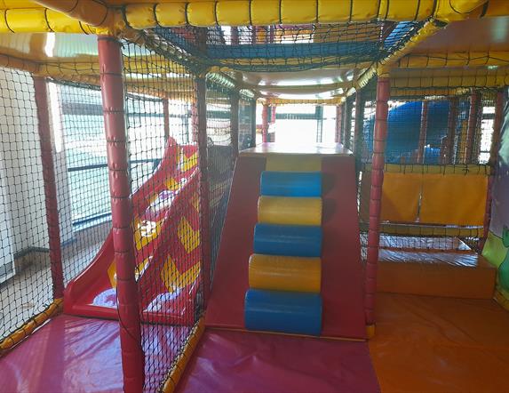 Ludo play area in Carrickfergus Amphitheatre featuring slides and climbing areas