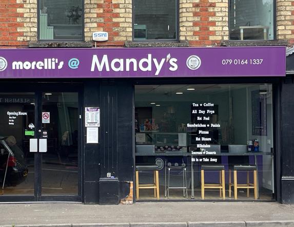 Shop front of Morelli's @ Mandy's with black frames and purple signage.