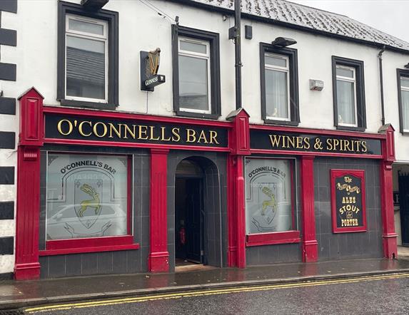 Red exterior of O'Connells Bar in Portglenone.