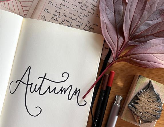Picture  of autumn notebook and art materials