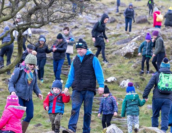 Crowds of people climbing Slemish on St Patricks Day