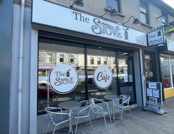 Exterior of The Stove in Larne with seats outside