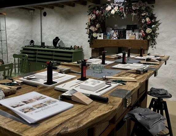 Table set up with equipment for jewellery making class at Vera McCullough's