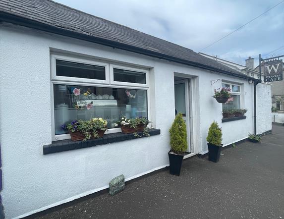 White cottage style exterior of Weavers Cafe in Ballycarry