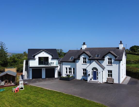 Image 1 - Birds eye of apartment and balcony attached to main house. 
