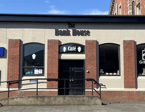 Building exterior of the red brick Bank House Cafe