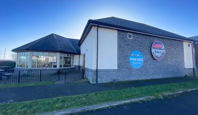 Front view of Brewers Fayre building in Carrickfergus with conservatory